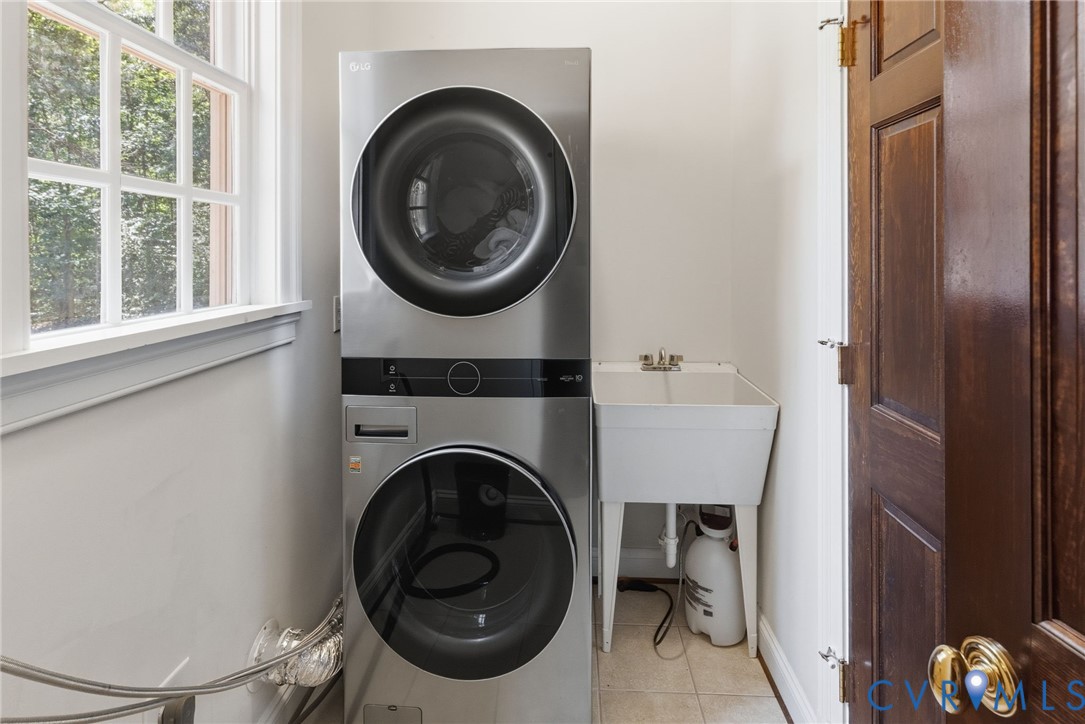 13173 Scotchtown Road Beaverdam, VA 23015 - Photo 55 of 65 a view of a hallway with washer and dryer