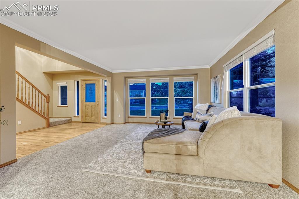 5514 Saxon Lane Colorado Springs, CO 80918 - Photo 13 of 50 a bedroom with a bed a dresser and windows