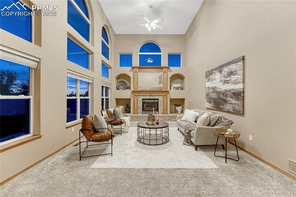 5514 Saxon Lane Colorado Springs, CO 80918 - Photo 21 of 50 a living room with fireplace furniture and a fireplace