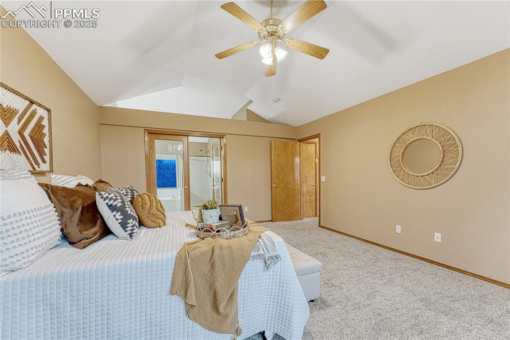 5514 Saxon Lane Colorado Springs, CO 80918 - Photo 25 of 50 a bedroom with a bed and a chandelier
