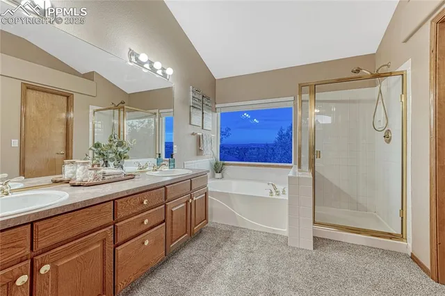 a spacious bathroom with a granite countertop sink mirror and shower