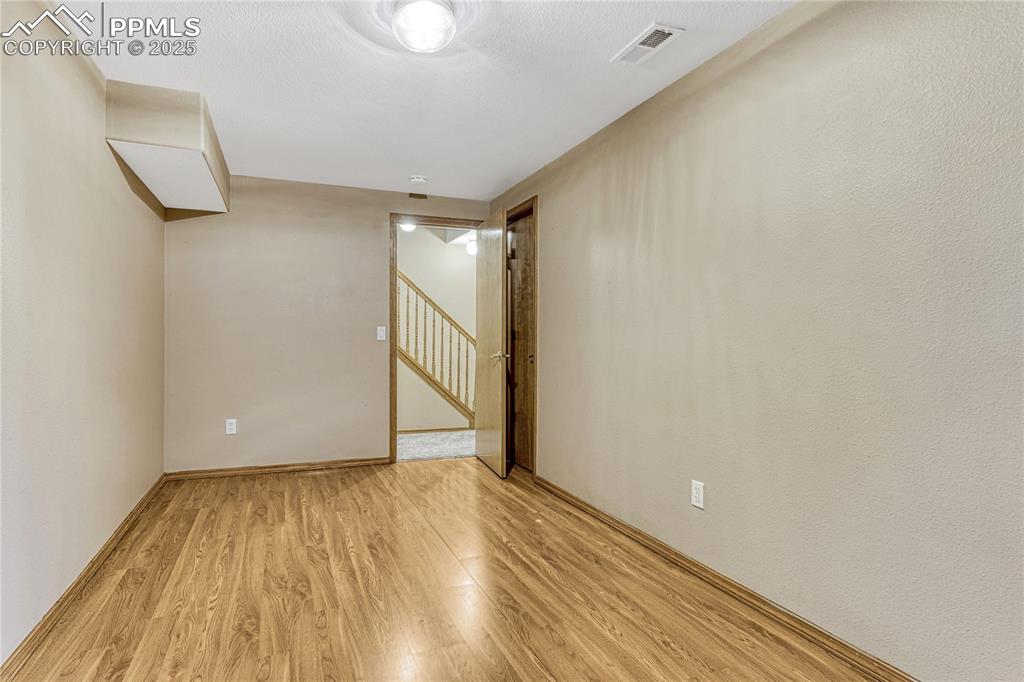 5514 Saxon Lane Colorado Springs, CO 80918 - Photo 34 of 50 a view of empty room with wooden floor