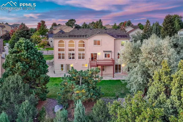 an aerial view of a house with a garden