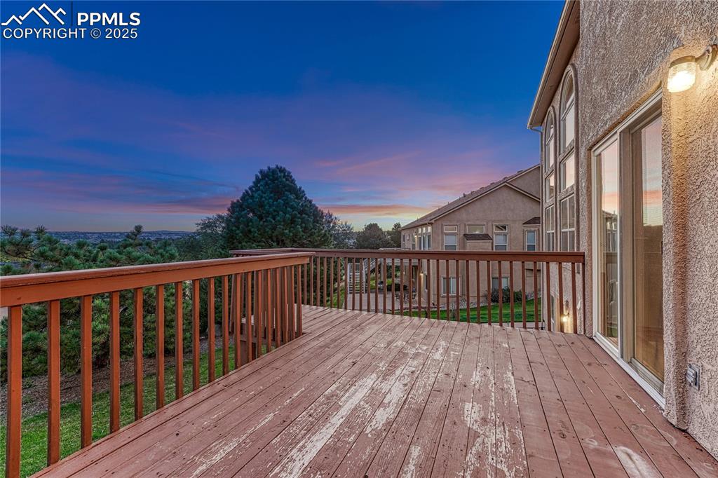 5514 Saxon Lane Colorado Springs, CO 80918 - Photo 45 of 50 a balcony with wooden floor and city view