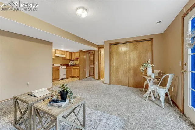 a living room with furniture and a table