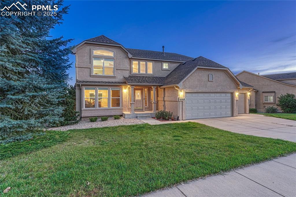 5514 Saxon Lane Colorado Springs, CO 80918 - Photo 9 of 50 a front view of a house with a yard
