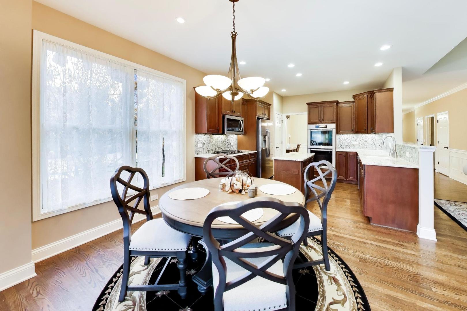 1N598 Golf View Lane Winfield, IL 60190 - Photo 13 of 33 a dining room with furniture and window
