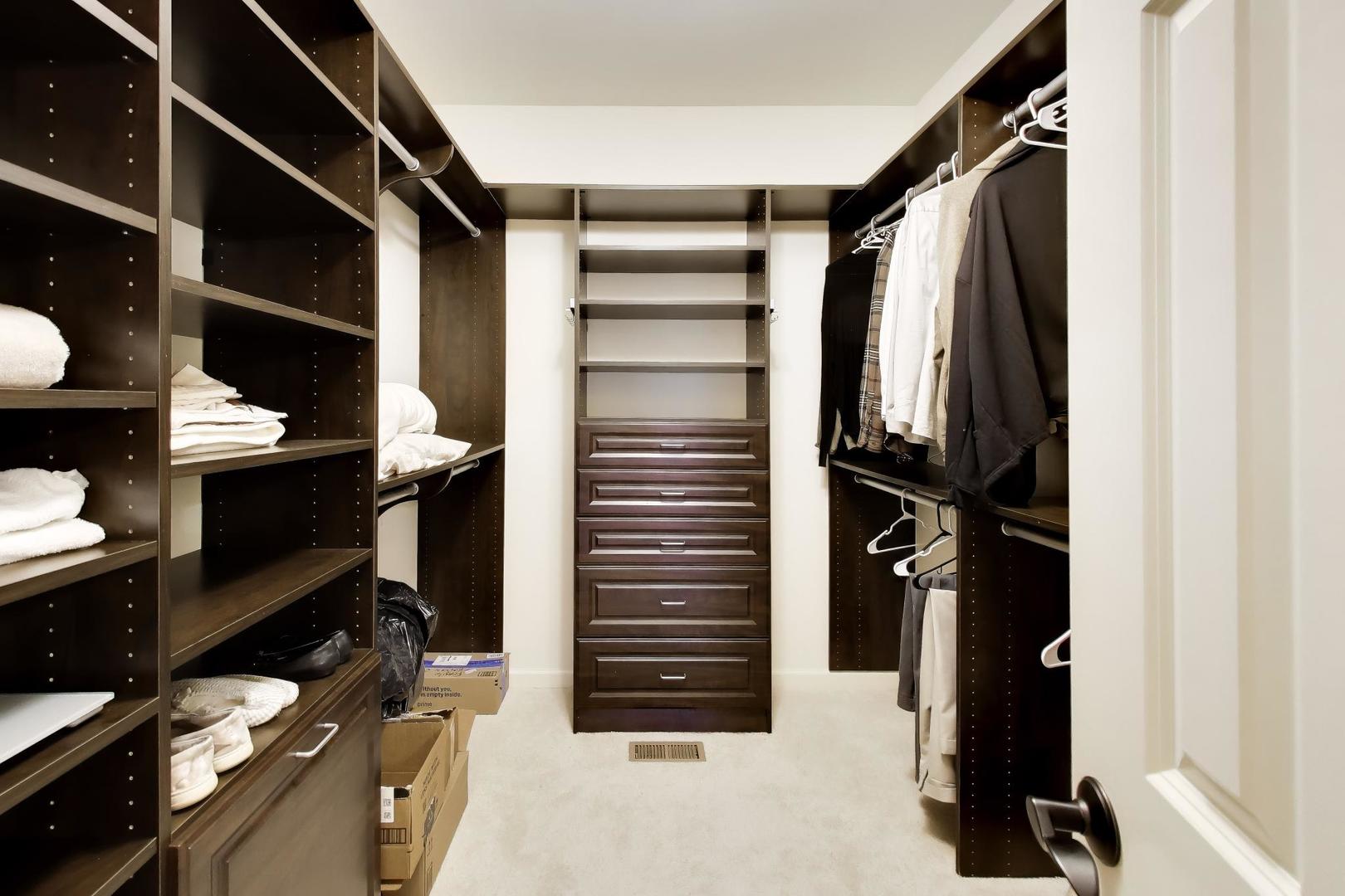 1N598 Golf View Lane Winfield, IL 60190 - Photo 19 of 33 a view of walk in closet with clothes and shoes