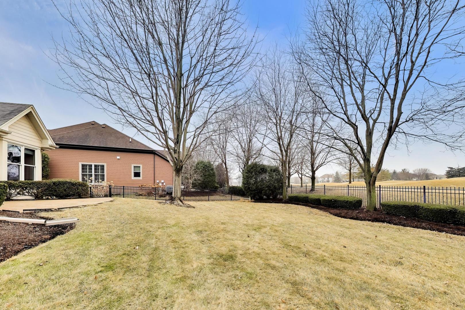 1N598 Golf View Lane Winfield, IL 60190 - Photo 33 of 33 a tall house with trees in front of it