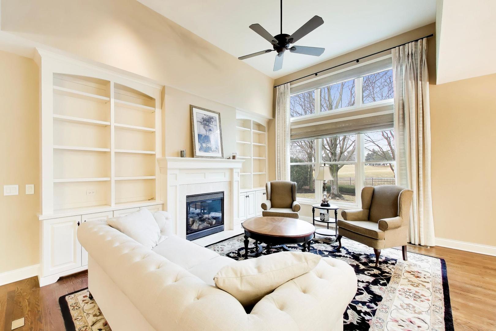 1N598 Golf View Lane Winfield, IL 60190 - Photo 5 of 33 a living room with furniture a fireplace and a window