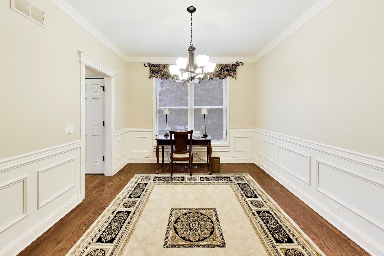 1N598 Golf View Lane Winfield, IL 60190 - Photo 7 of 33 a view of a room with wooden floor and furniture