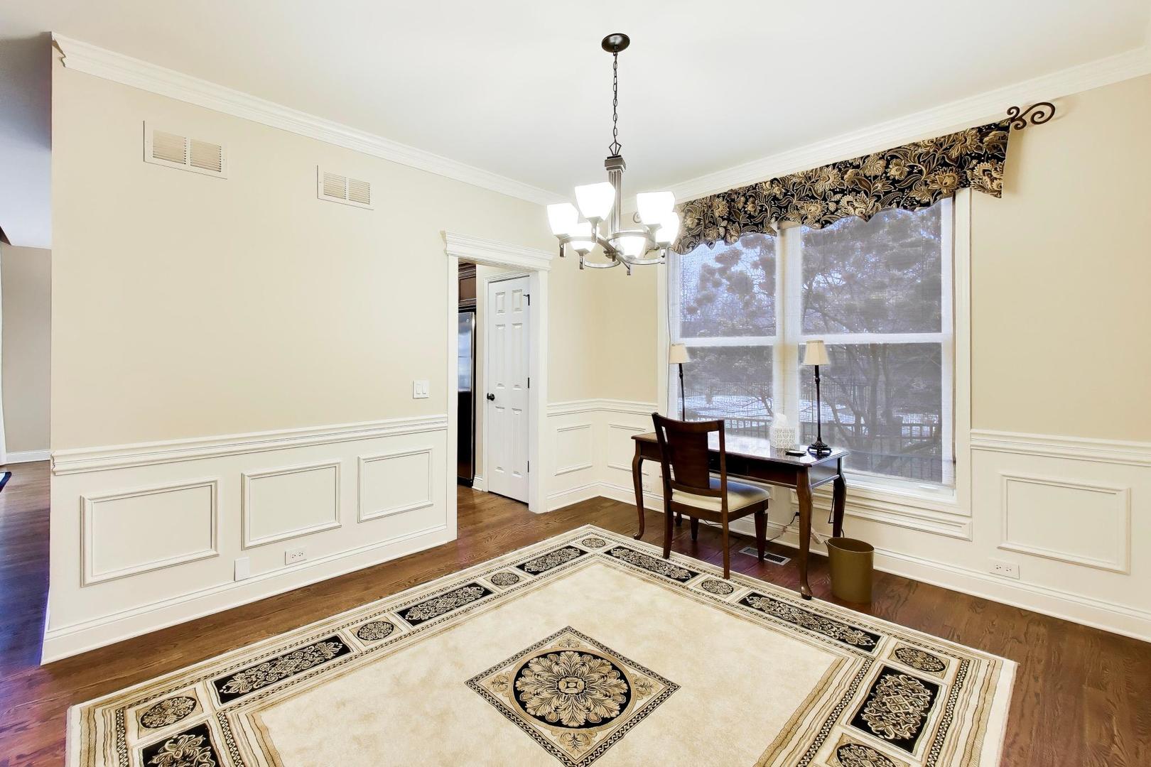 1N598 Golf View Lane Winfield, IL 60190 - Photo 8 of 33 a view of a dining room with furniture window and wooden floor
