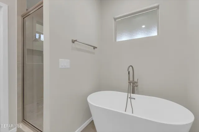 a white bath tub sitting in a bathroom