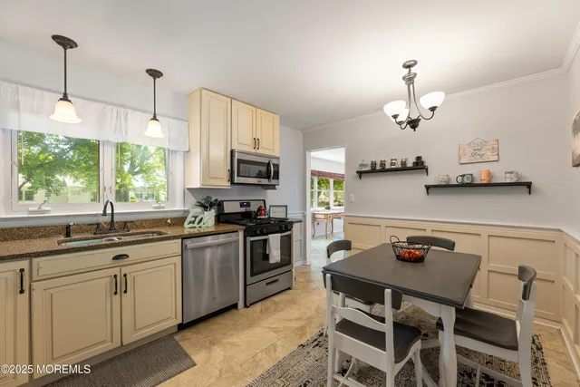 a kitchen with a table chairs stove and microwave