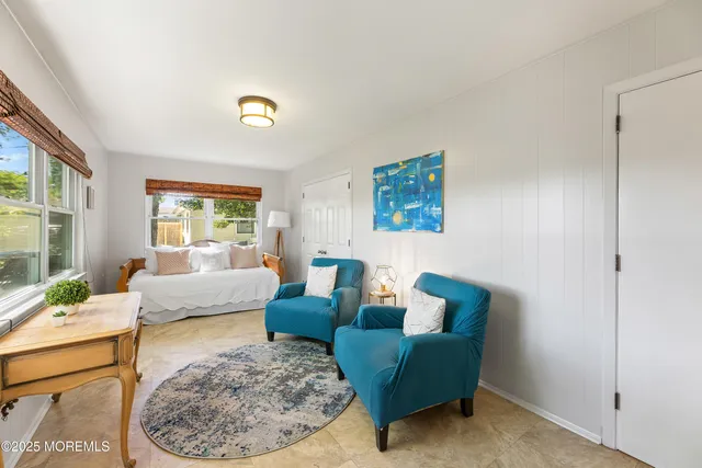 a living room with furniture and a rug