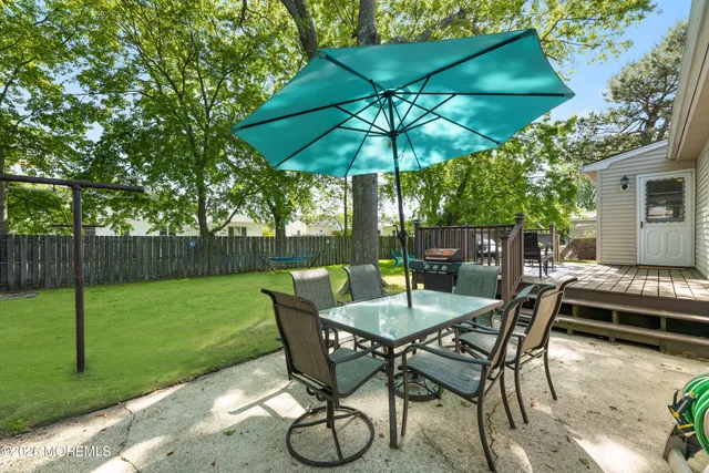 a view of yard with patio and outdoor seating
