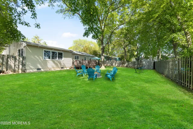 a view of a house with a yard porch and sitting area