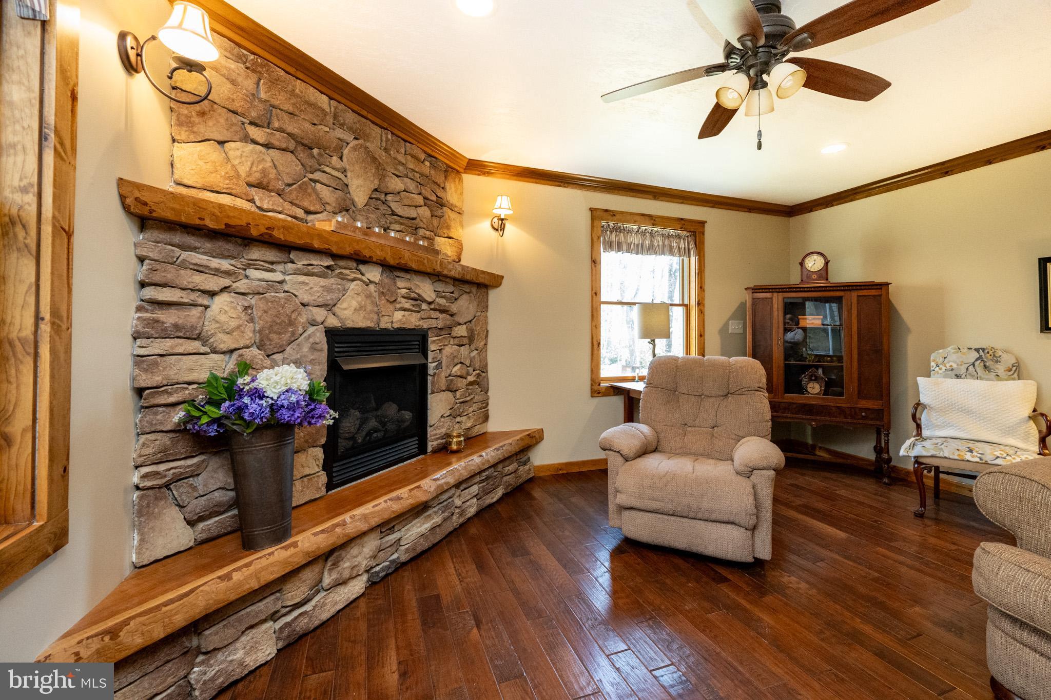 328 Stool Rock Road Oakland, MD 21550 - Photo 45 of 133 a living room with furniture and a fireplace