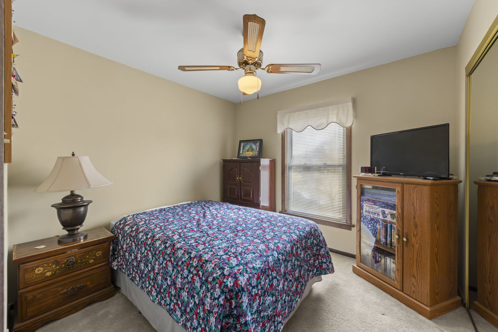 580 Whitehall Way Bolingbrook, IL 60440 - Photo 12 of 25 a bedroom with a bed and a flat tv screen on the dresser