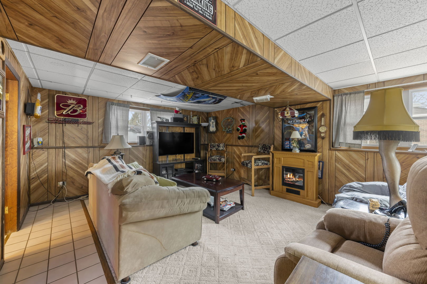 580 Whitehall Way Bolingbrook, IL 60440 - Photo 17 of 25 a living room with furniture a flat screen tv and a table
