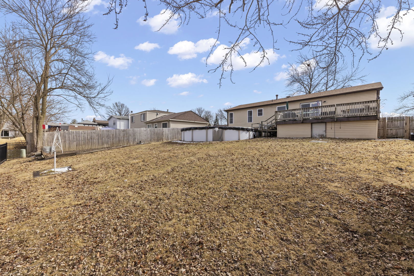 580 Whitehall Way Bolingbrook, IL 60440 - Photo 21 of 25 a house with a yard covered with snow in the background