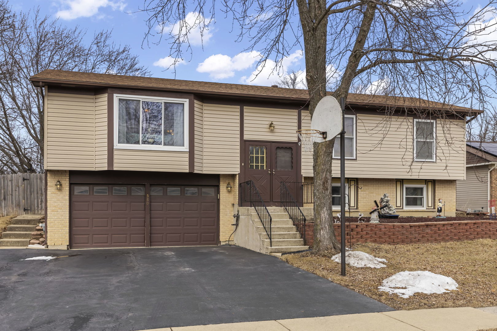 580 Whitehall Way Bolingbrook, IL 60440 - Photo 22 of 25 a front view of a house with a tree