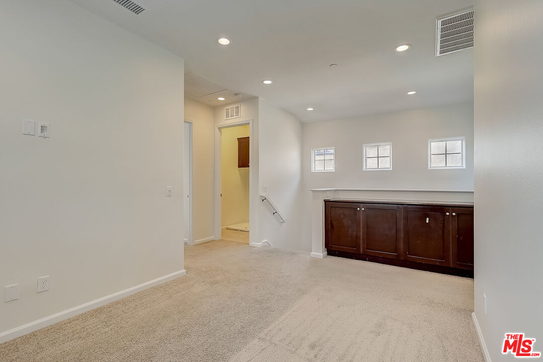 130 Firefly Irvine, CA 92618 - Photo 16 of 29 a view of an empty room with a kitchen