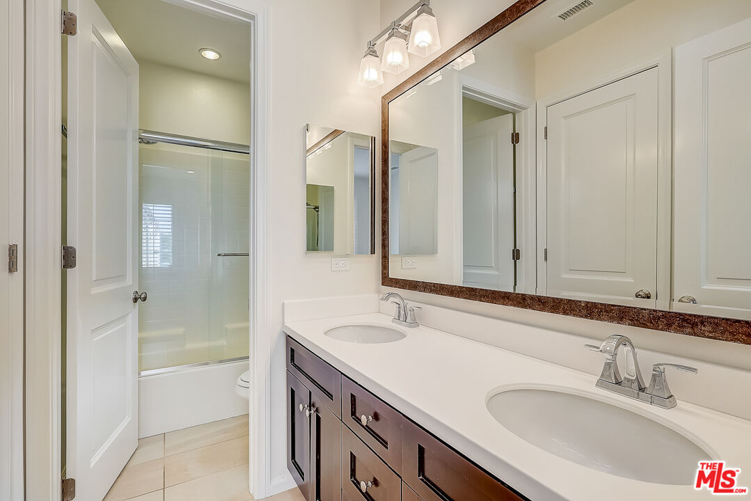 130 Firefly Irvine, CA 92618 - Photo 21 of 29 a bathroom with a sink and a mirror