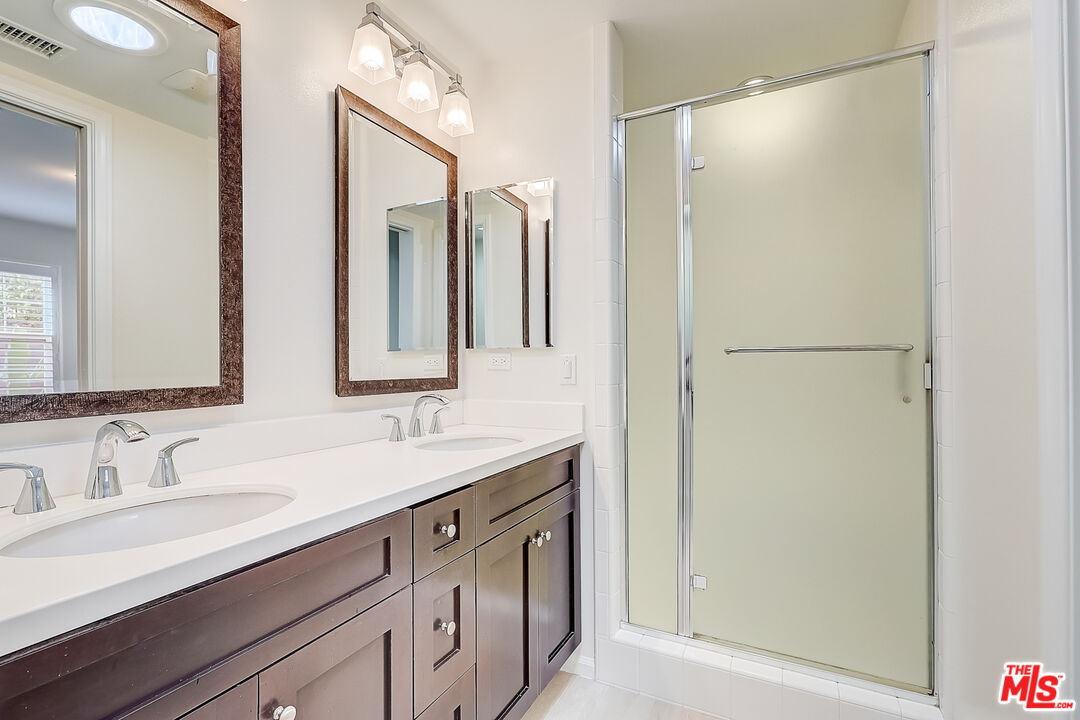 130 Firefly Irvine, CA 92618 - Photo 7 of 29 a bathroom with a double vanity sink mirror and double