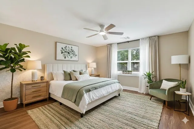 a bedroom with a large bed and a couch