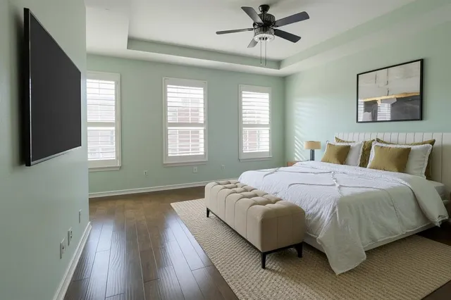 a bed sitting in a bedroom next to a window