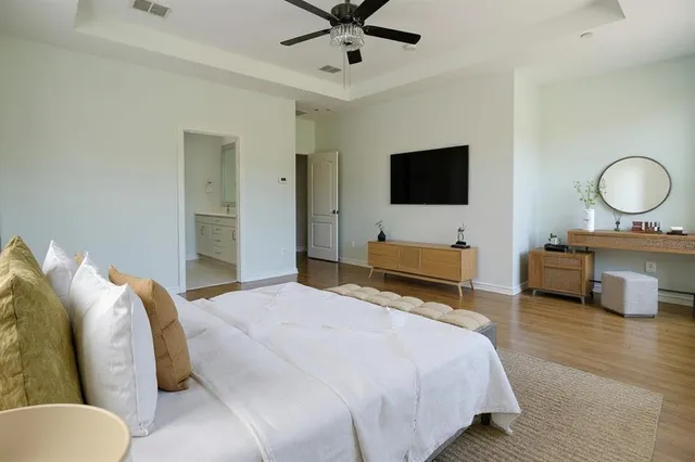 a bedroom with a bed and a television