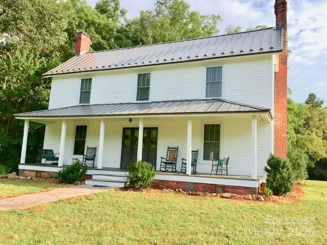 front view of a house with a swimming pool