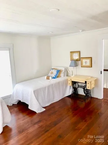 a bedroom with a bed and a table in it