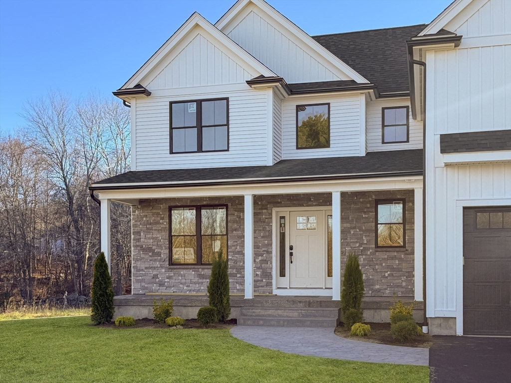 front view of a house with a yard