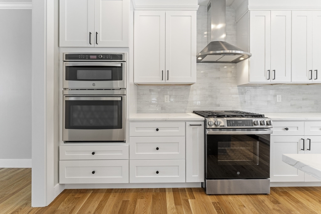 29 Thornton Street Mendon, MA 01756 - Photo 12 of 42 a kitchen with stainless steel appliances a stove and cabinets