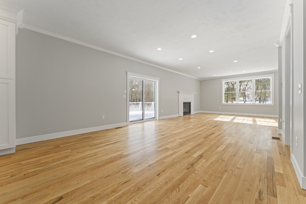 29 Thornton Street Mendon, MA 01756 - Photo 13 of 42 a view of an empty room with wooden floor and a window