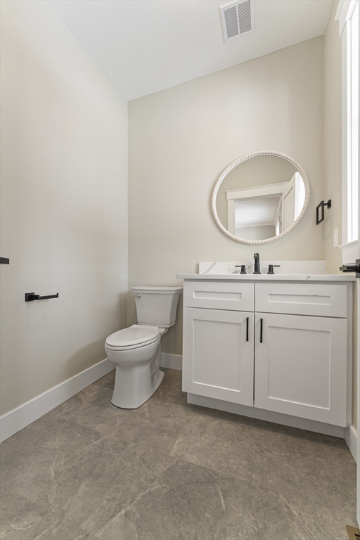 29 Thornton Street Mendon, MA 01756 - Photo 16 of 42 a bathroom with a toilet sink and mirror