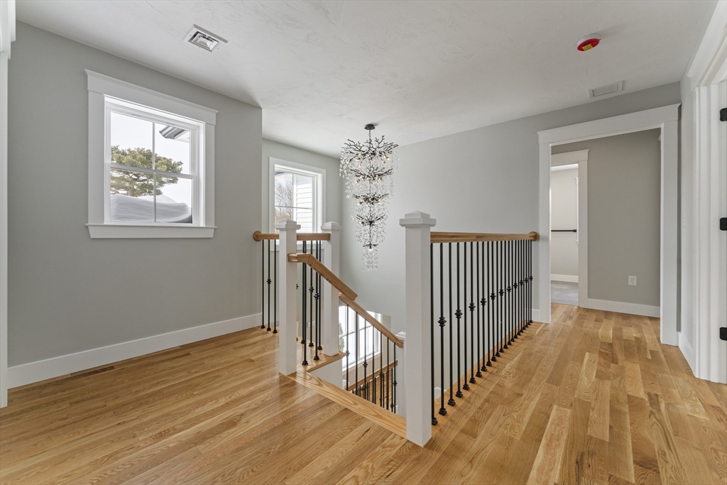 29 Thornton Street Mendon, MA 01756 - Photo 18 of 42 a view of a hallway view with wooden floor and windows