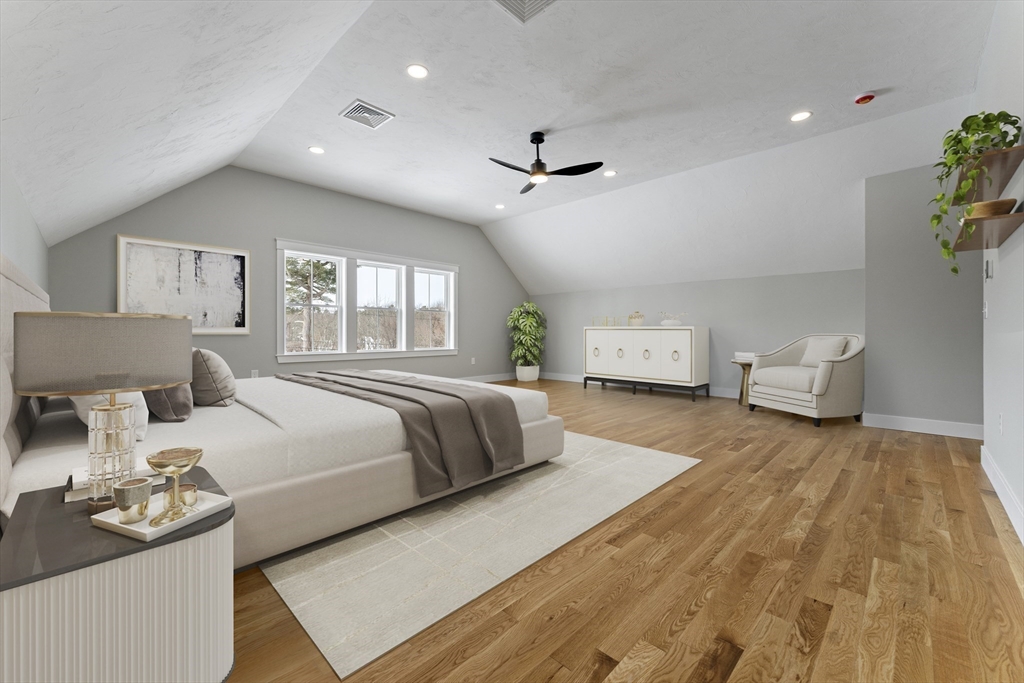 29 Thornton Street Mendon, MA 01756 - Photo 22 of 42 a bedroom with a large bed and a chandelier