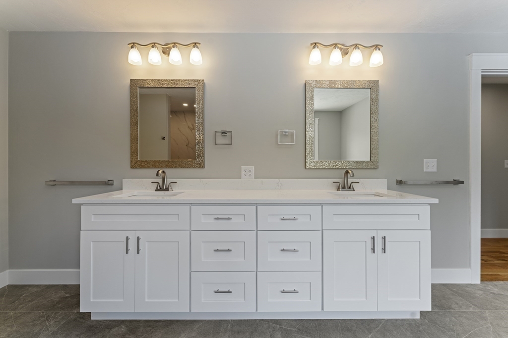 29 Thornton Street Mendon, MA 01756 - Photo 24 of 42 a bathroom with double sink and a mirror