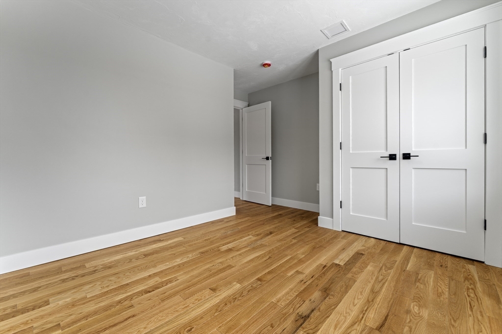 29 Thornton Street Mendon, MA 01756 - Photo 33 of 42 a view of an empty room and wooden floor