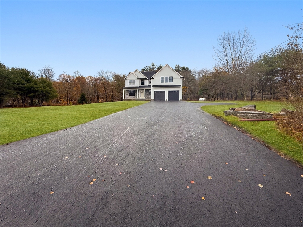 29 Thornton Street Mendon, MA 01756 - Photo 42 of 42 a front view of a house with a yard and trees