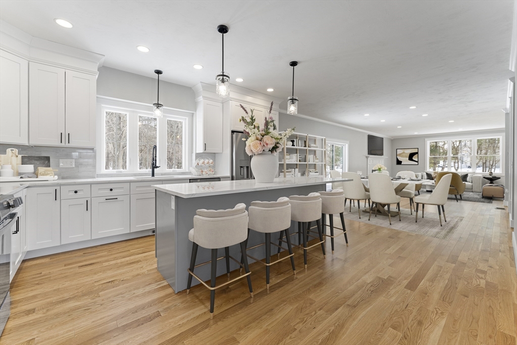 29 Thornton Street Mendon, MA 01756 - Photo 9 of 42 a large kitchen with lots of counter space and dining table chairs