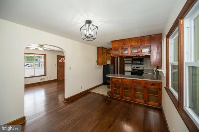 a view of a room with wooden floor and window