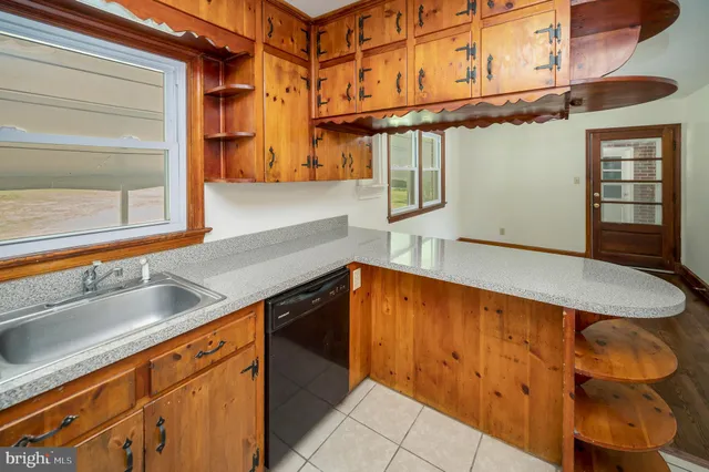 a kitchen with a sink and cabinets