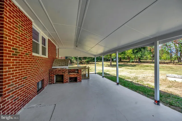 a view of swimming pool with outdoor seating