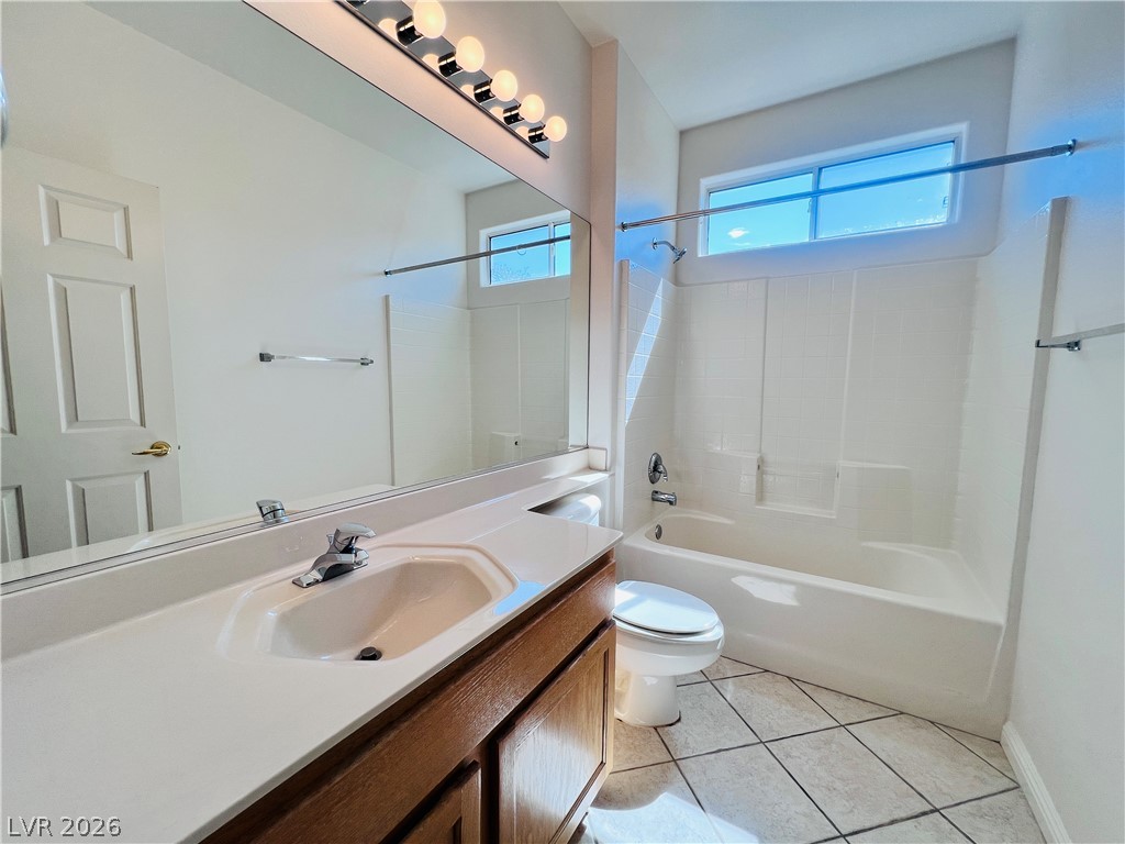 3047 Hickory Valley Road Henderson, NV 89052 - Photo 20 of 33 A well-appointed bathroom features a single vanity, ample mirror, and a classic tub/shower combination.