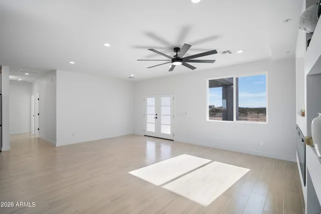 a view of an empty room with a window