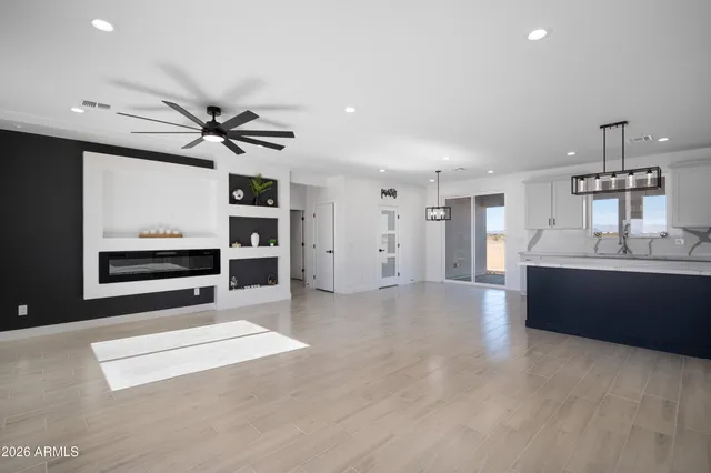 a view of a kitchen with a sink and a large window